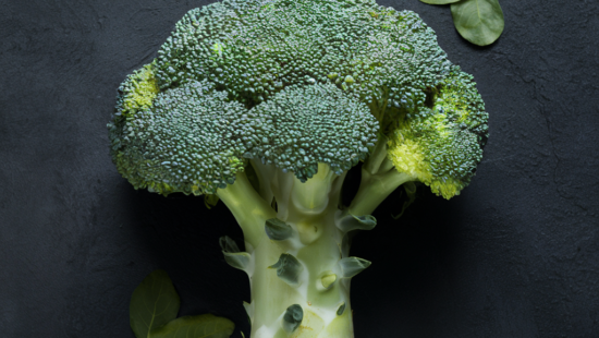 a broccoli on a black surface